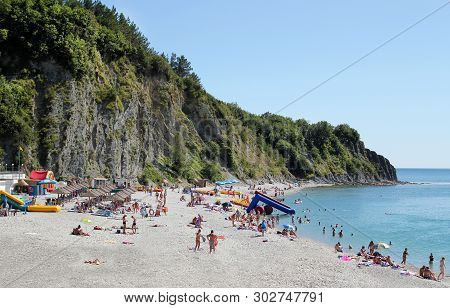 Olginka, Russia - May 24, 2019: Holidaymakers On The Beach, Olginka Village, Tuapse, The Black Sea, 