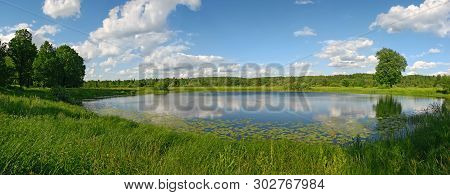 Lake At The Green Meadow With Cloudscape Rflection