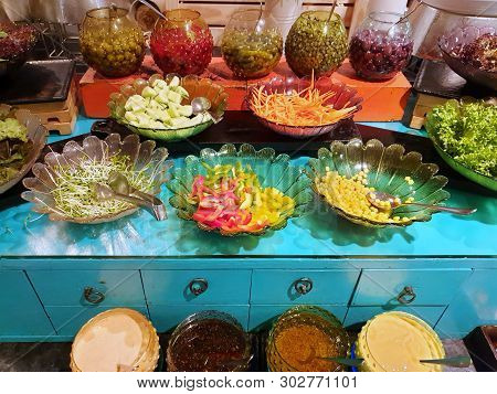 Salad Bar, Fresh Vegetable With Bell Peppers, Carrot, Corn, Lettuce, Cucumber And ยickled Olives In 
