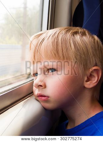 Sad Kid Sit In The Train By The Window