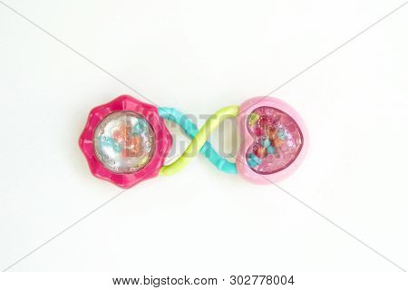 Newbor Toy. A Colorful Baby Rattle On A White Horizontal Background