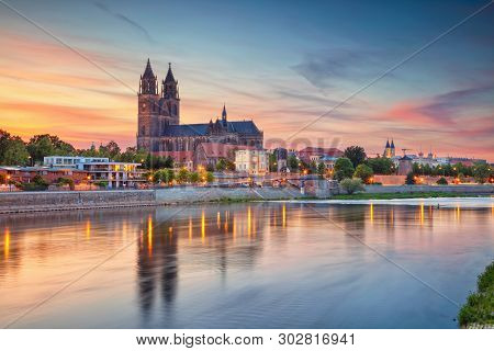 Magdeburg, Germany. Cityscape Image Of Magdeburg, Germany With Reflection Of The City In The Elbe Ri