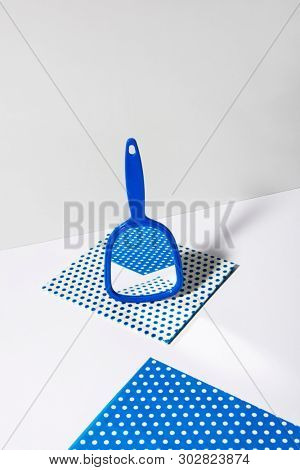 Hand mirror on spotted patterned wipe, showing different reflection of images.  Abstract conception. Mirror collection.