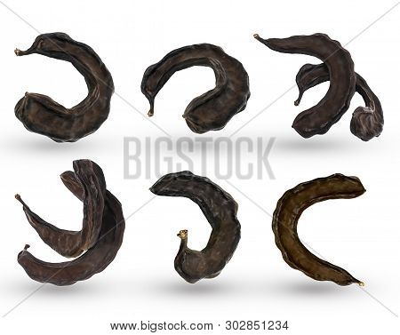 Close-up Dried Brown Carob Fruits Isolated On White Background. Healthy Cocoa Substitute.