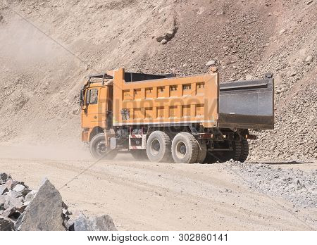 Almaty, Kazakhstan - May 20, 2019: Chinese Shacman Dump Truck At The Mine Is Waiting For Loading.