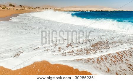 Closeup Image Of Calm Beautiful Sea Waves Rooling On The Sand At Beach. Landscape Of Ocean Shore At 