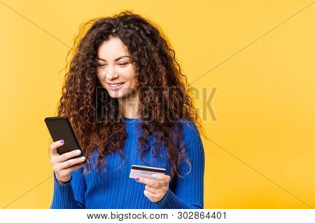 Beautiful Young Woman With Smartphone Credit Card. Online Shopping Transaction. Mobile Banking Urban