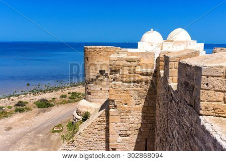 Tower Of The Borj El Kebir Castle With Background Of Mediterranean Sea In Houmt El Souk In Djerba, T