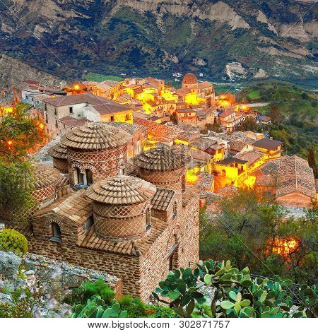 Sunset Over Old Famous Medieval Village Stilo In Calabria. View On Church And City. Southern Italy. 