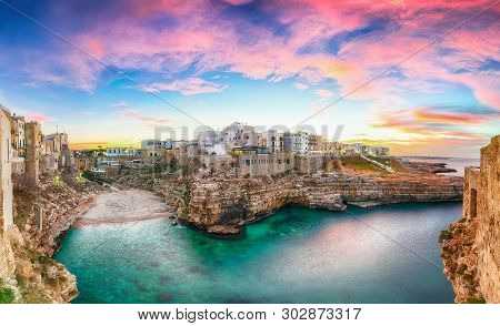 Sunset At Cala Paura Gulf With Bastione Di Santo Stefano And Lama Monachile Beach In Background. Pol