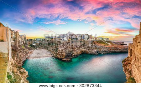 Sunset At Cala Paura Gulf With Bastione Di Santo Stefano And Lama Monachile Beach In Background. Pol