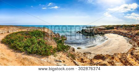 Picturesque Seascape With White Rocky Cliffs, Sea Bay, Islets And Faraglioni Near By Conca Specchiul