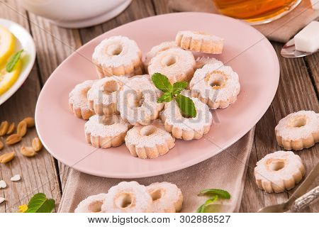Canestrelli Biscuits With Mint On White Dish.