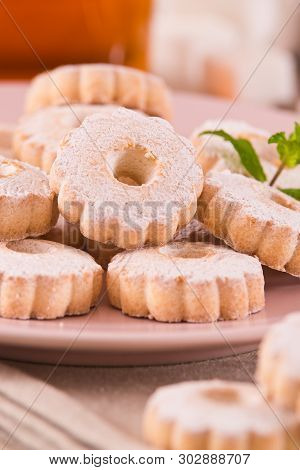 Canestrelli Biscuits With Mint On White Dish.