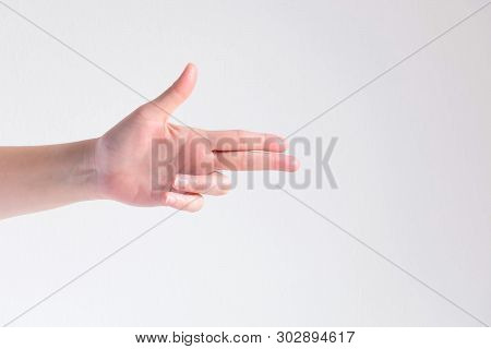 A Hand Posturing To Be Shotgun Point To The Target On White Background; Concept Of Firmness And Got 