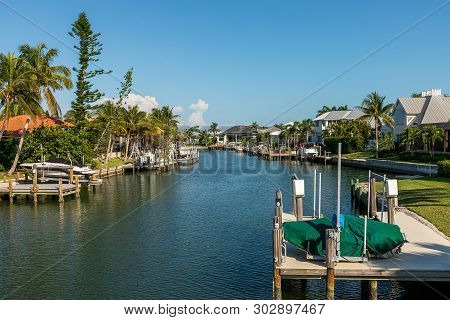 Blue Sky Over A Riverway Through Marco Island In Naples, Florida Around Noon.