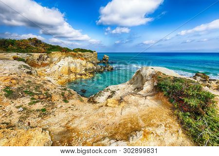 Picturesque Seascape With White Rocky Cliffs, Sea Bay, Islets And Faraglioni Near By Conca Specchiul
