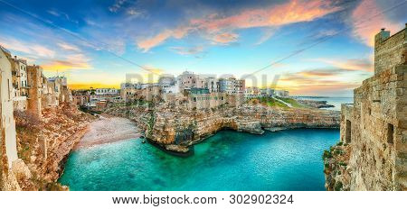 Sunset At Cala Paura Gulf With Bastione Di Santo Stefano And Lama Monachile Beach In Background. Pol