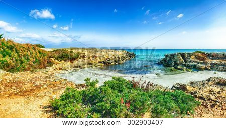 Picturesque Seascape With White Rocky Cliffs, Sea Bay, Islets And Faraglioni Near By Conca Specchiul