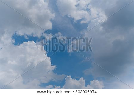 Beautiful Bright Blue Sky With White Fluffy Clouds On A Clear Sunny Day. Royalty High-quality Free S