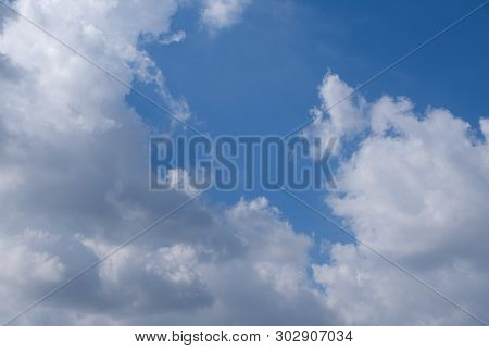 Beautiful Bright Blue Sky With White Fluffy Clouds On A Clear Sunny Day. Royalty High-quality Free S