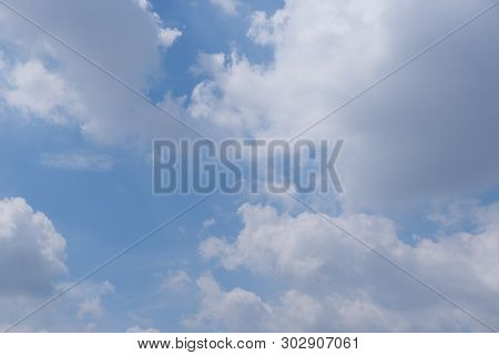 Beautiful Bright Blue Sky With White Fluffy Clouds On A Clear Sunny Day. Royalty High-quality Free S