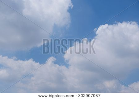 Beautiful Bright Blue Sky With White Fluffy Clouds On A Clear Sunny Day. Royalty High-quality Free S