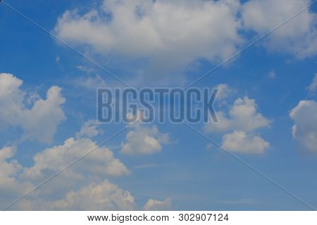 Beautiful Bright Blue Sky With White Fluffy Clouds On A Clear Sunny Day. Royalty High-quality Free S