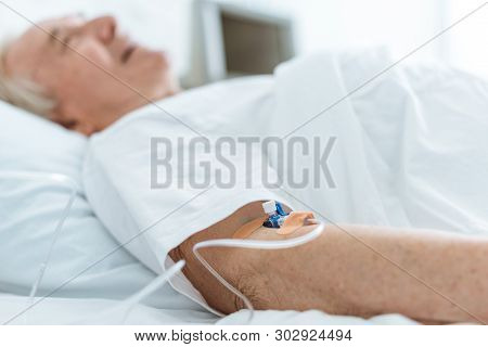 Selective Focus Of Senior Patient In Coma In Hospital