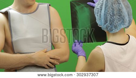 Man With Shoulder Injury. Wearing A Bandage For Fixing Of An Elbow Joint And A Humeral Belt. Disloca