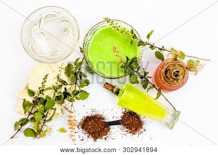 Tulsi Face Pack Isolated On White Consisting Of Sandal Wood Powder Well Mixed With Tulsi Leaves With