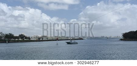 Boat On Mooloolah River On A Sunny But Cloudy Day. Rock Wall Along Mooloolah River (sunshine Coast, 
