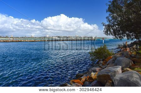 Mooloolaba Marina On Mooloolah River On A Sunny But Cloudy Day. Rock Wall Along Mooloolah River (sun