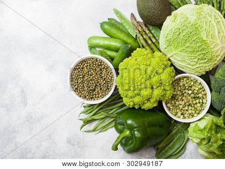 Assorted Green Toned Raw Organic Vegetables On White Background. Avocado, Cabbage, Broccoli, Caulifl