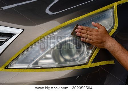 Closeup Car Lamp Or Front Headlight Polishing, Renewed Headlamp