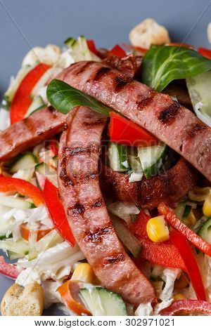Salad With Grilled Sausage Paprica Cucumber And Croutons