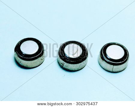 A Picture Of Round Battery On White Background