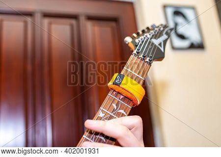 Miercurea Ciuc, Romania- 05 January 2021: Young Musician Playing On Ibanez Guitar Using A Gruvgear F
