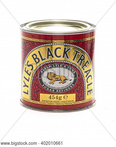 Swindon, Uk - January 5, 2021:  Tin Of Lyles Black Treacle On A White Background