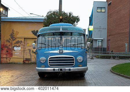 Tallinn. Estonia December 18, 2020 Old Bus, Christmas Tree On The Roof. Bus Station. High Quality Ph