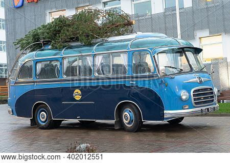 Tallinn. Estonia December 18, 2020 Old Bus, Christmas Tree On The Roof. Bus Station. High Quality Ph