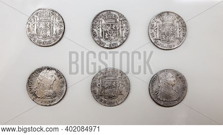 Cartagena, Spain - September 14th, 2018: 6 Silver Spanish Pieces Of Eight. Arqua Museum, Spain