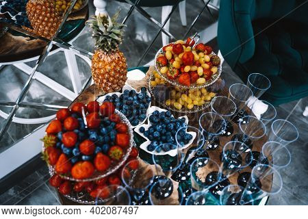 Buffet Table With Whatnots With Fruits, Champagne Glasses