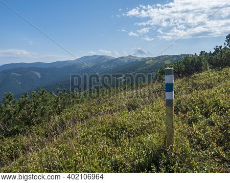 Sign Pole With Tourist Mark At Ridge Of Low Tatras Mountains, Hiking Trail With Mountain Meadow, Scr