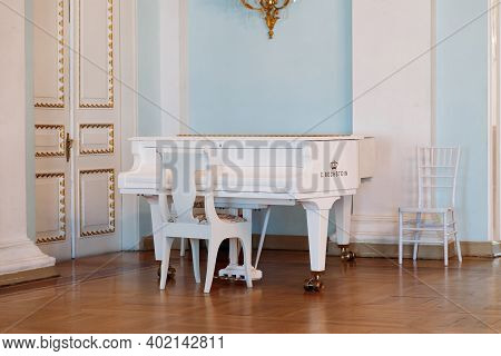 Saint Petersburg, Russia, 18.04.2019, Yusupov Palace Dance Hall. Baroque White Piano C. Bechstein