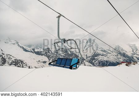Ski Chair Lift Ropeway At The Ski Resort, View From The Funicular To The Mountains