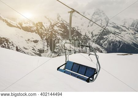 Ski Chair Lift Ropeway At The Ski Resort, View From The Funicular To The Mountains