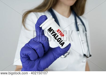 Medicine And Health Concept. The Doctor Holds A Medicine In His Hands, Which Says - Stop Myalgia