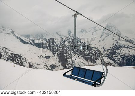 Ski Chair Lift Ropeway At The Ski Resort, View From The Funicular To The Mountains