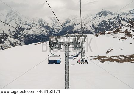 Ski Chair Lift Ropeway At The Ski Resort, View From The Funicular To The Mountains
